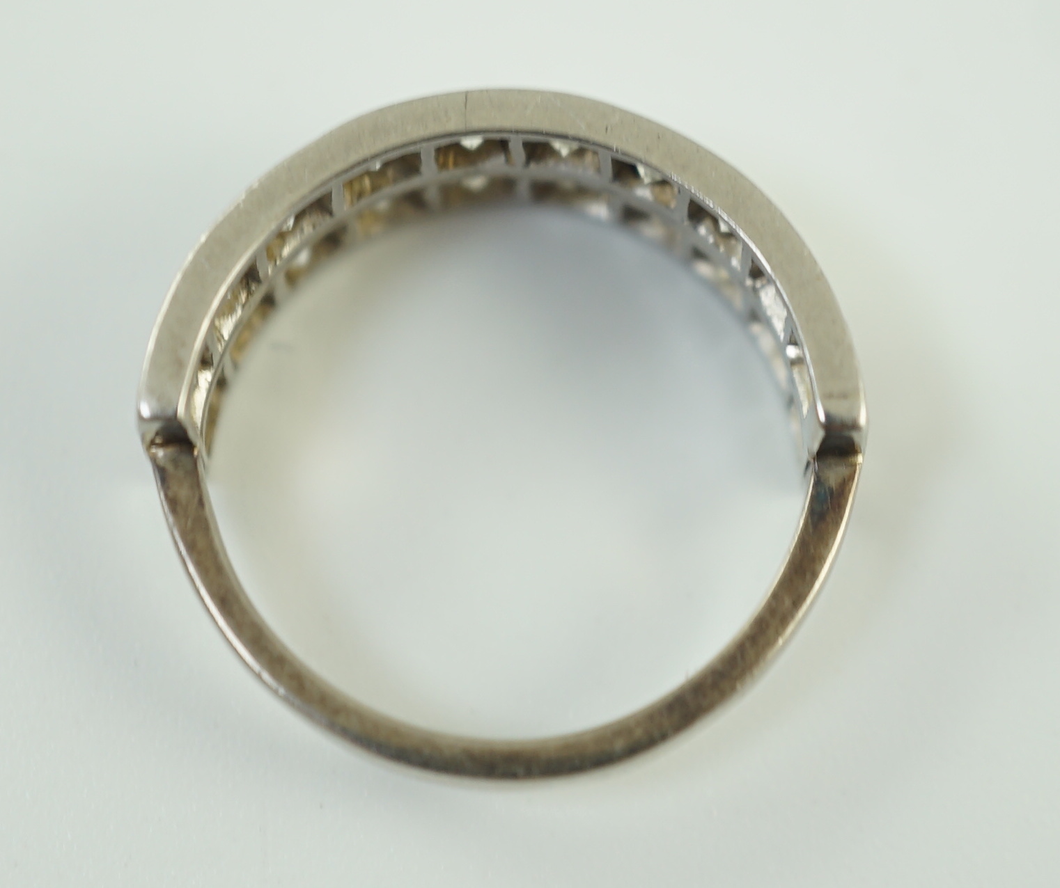 A white gold and two row twenty stone diamond set half eternity ring